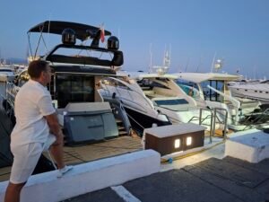 Puerto Banús Nightlife: Our First-Hand Marbella Guide Luxury cars and evening crowds in Puerto Banús, Marbella