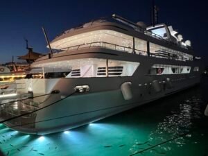 Puerto Banús Nightlife: Our First-Hand Marbella Guide Superyachts moored in Puerto Banús marina at night with reflections on the water