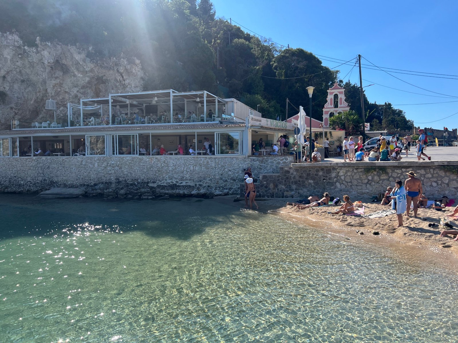 Small shore beside a waterfront terrace at Agios Spyridon bay