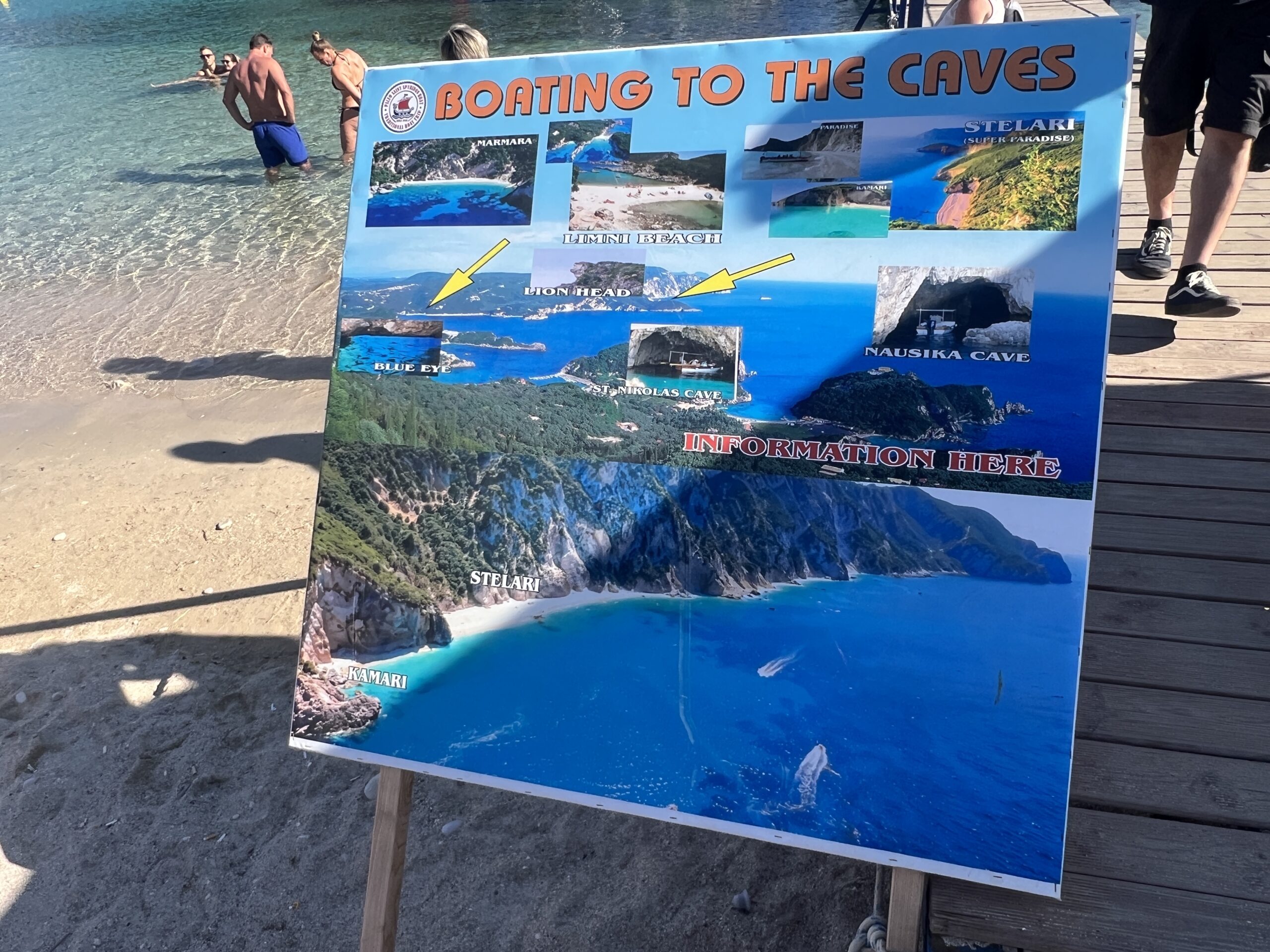 Cave and beach boat-trip board at Agios Spyridon Beach