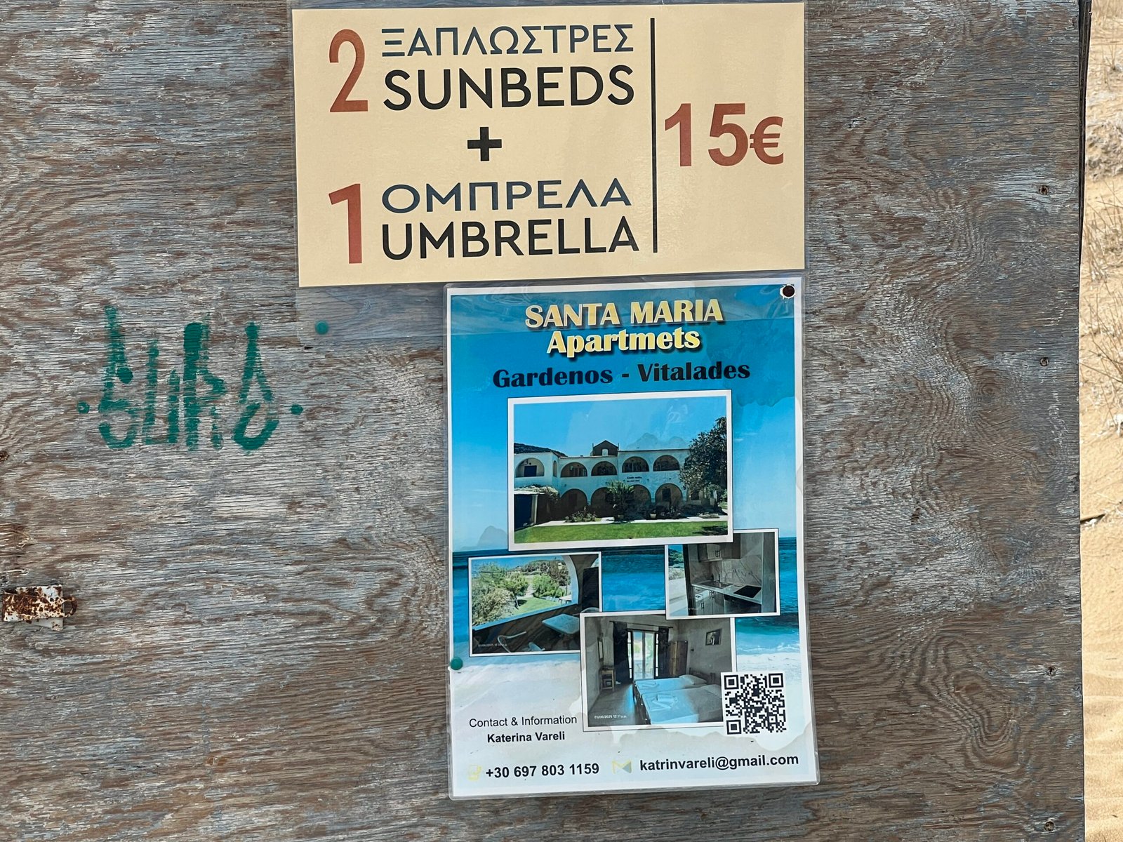 Sign offering two sunbeds and one umbrella for 15 euros