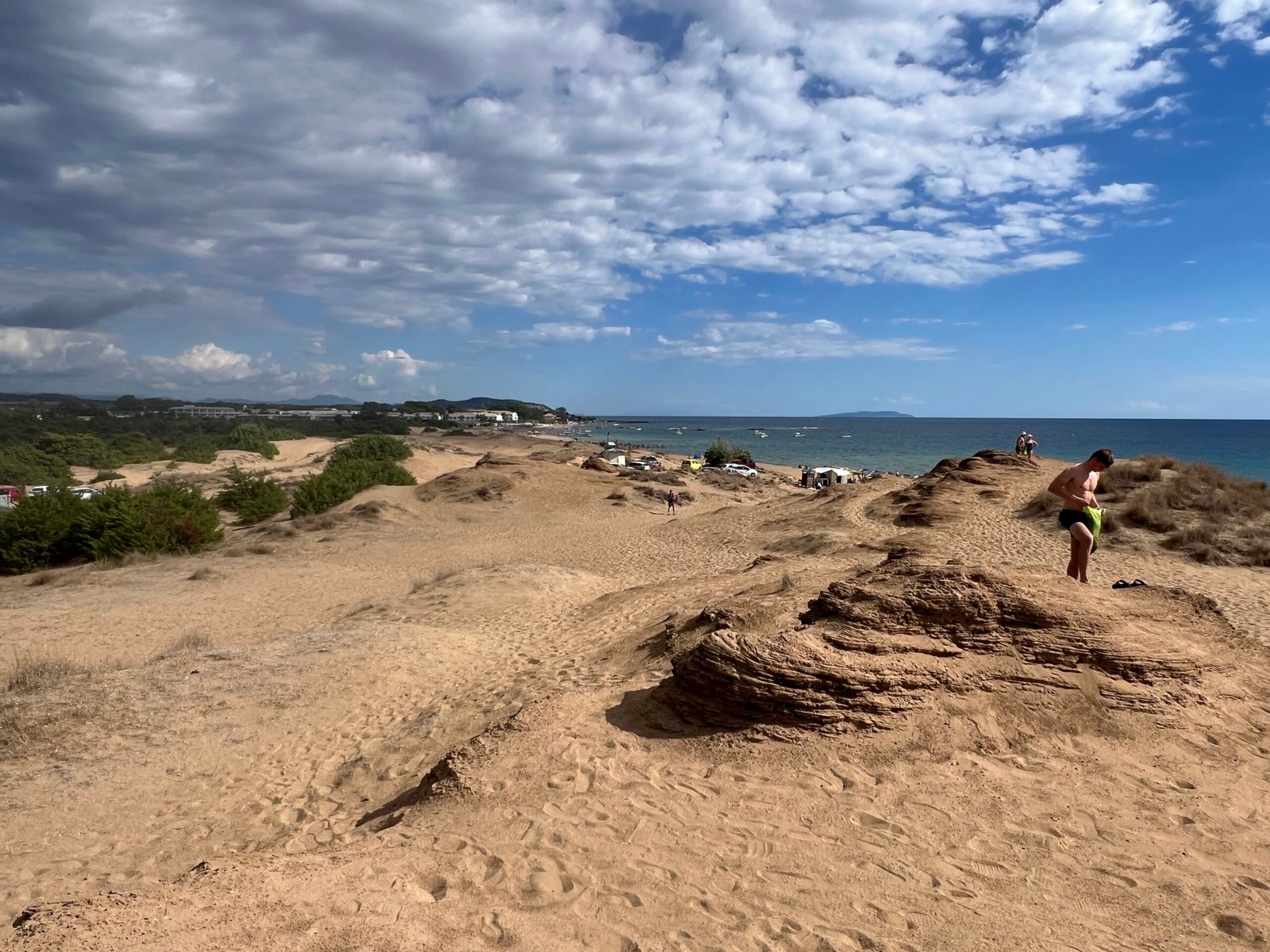 Sand dunes with the sea and beach in the distance