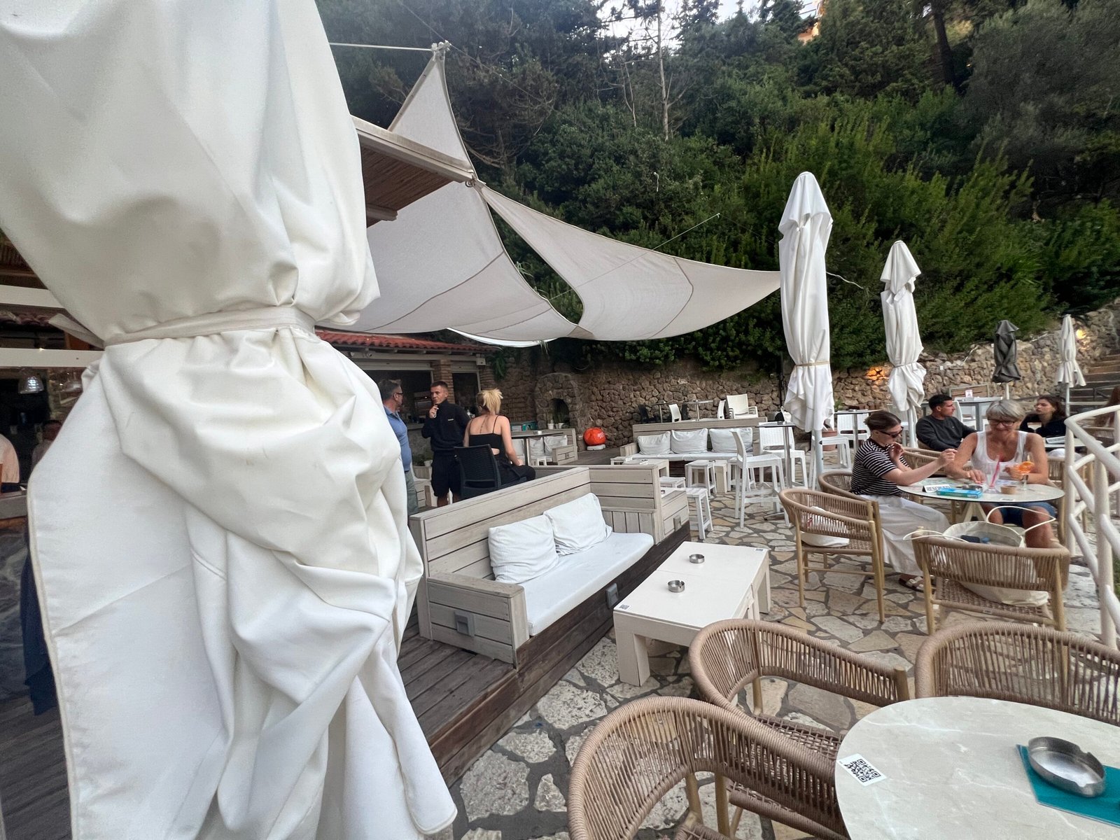 La Grotta bar seating with white parasols and shade sails