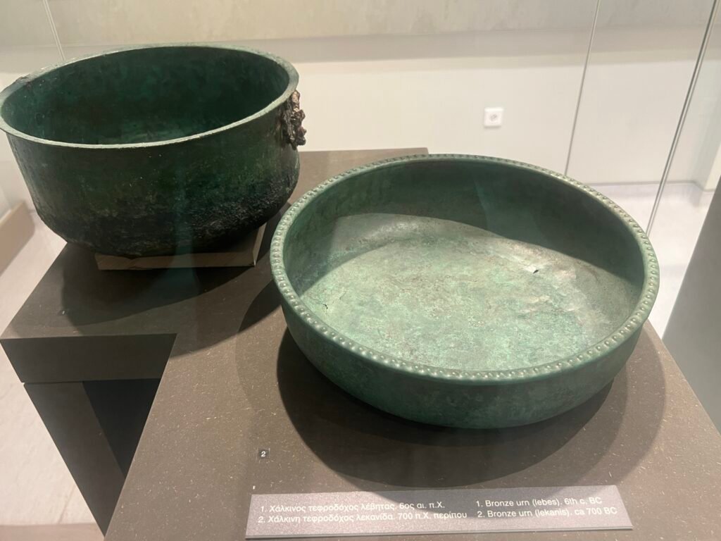 Bronze urns: a lebes from the sixth century BC and a lekanis dated around 700 BC.